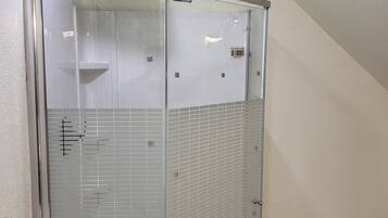 Shower, towels, soap, toilet paper