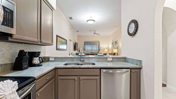 Condo, Multiple Beds, Balcony, Garden View (Peaceful Horizons at Caribe Cove) | Private kitchen | Fridge, microwave, oven, stovetop