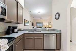 Condo, Multiple Beds, Balcony, Garden View (Peaceful Horizons at Caribe Cove) | Private kitchen | Fridge, microwave, oven, stovetop
