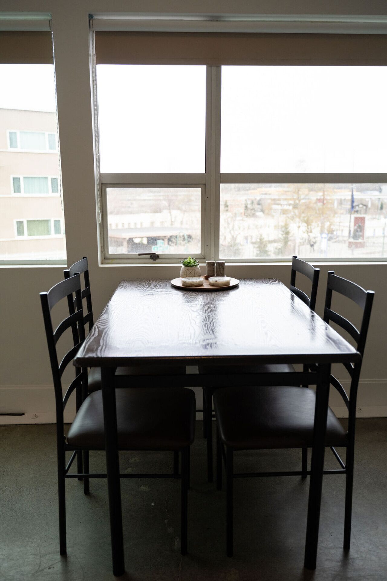 A dining area with a rectangular table and six chairs.