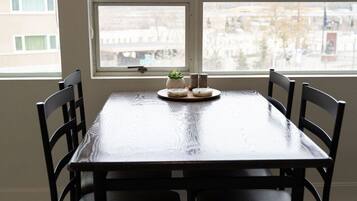A dining area with a rectangular table and six chairs.