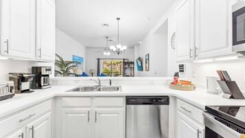 Condo, Multiple Beds, Hot Tub, Garden View (Serene Stay At Bahama Bay) | Private kitchen | Fridge, microwave, oven, stovetop