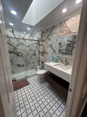 Shower, hair dryer, towels, soap