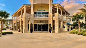 A hotel with a central atrium, balconies, and a sign reading "Euphorbia." - Tropical Vibes (Kissimmee)