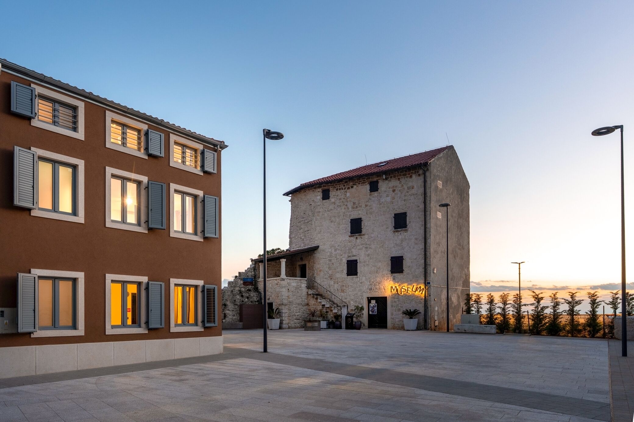 A building with a stone facade and a sign that reads "MUSEUM".