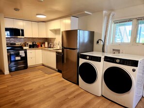 Fridge, microwave, oven, stovetop - Beautiful 2-bedroom basement suite with kitchen and Wi-Fi on Herring Cove Road (Herring Cove)