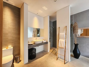 Separate tub and shower, hair dryer, slippers, towels