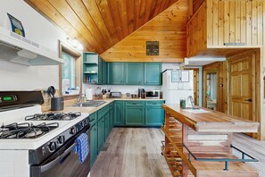 Fridge, microwave, oven, stovetop - Scenic retreat with a spacious deck, gas fireplace, and Moosehead Lake views (Greenville)