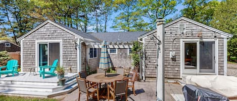 Enjoy a patio with a round table and chairs, perfect for outdoor dining and relaxation.