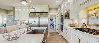 Luxurious beach house with outdoor dining and elegant design - steps to beach