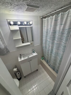 Hair dryer, towels, soap, toilet paper