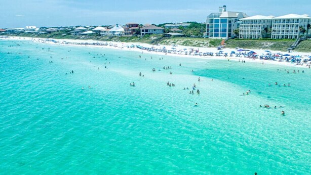 A coastal hotel with a beach view, multiple guest rooms, and a pool area. - Sleeps 10 - The Salty Piper - Community pool (Santa Rosa Beach)