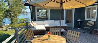 Your own peninsula with beaches, private docks, amazing sunset and motor boat