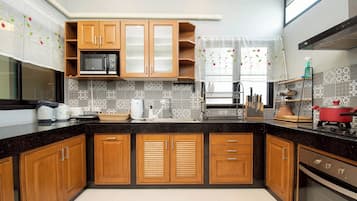 Villa | Private kitchen | Full-size fridge, microwave, dishwasher, electric kettle
