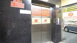 An elevator with signs for 'LIFT-1' and 'Golden Dreams Banquets'. - Fabhotel Golden Eye Inn (New Delhi)