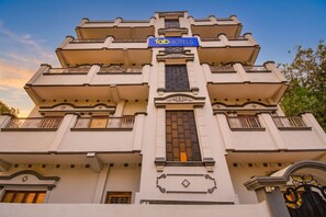 A multi-story building with a sign reading 'fab hotels' at the top. - FabHotel RB Palace - Nr. Varanasi Junction (Cantt) Railway Station (Varanasi)