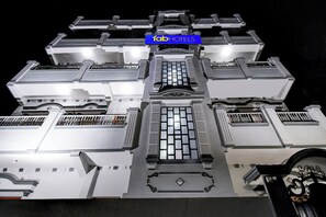 A model of a hotel with a central atrium, multiple floors, and a sign reading 'fab hotels'. - FabHotel RB Palace - Nr. Varanasi Junction (Cantt) Railway Station (Varanasi)