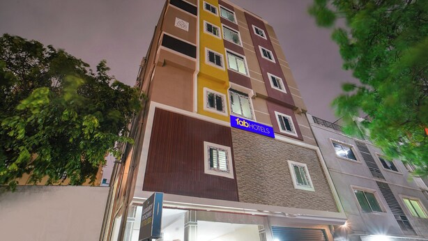 A multi-story hotel with a sign for 'Fab Hotels'. - Fabhotel Sbr (Hyderabad)
