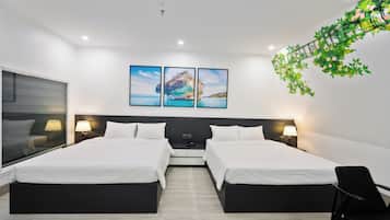 Deluxe Quadruple Room, City View | Premium bedding, minibar, in-room safe, laptop workspace