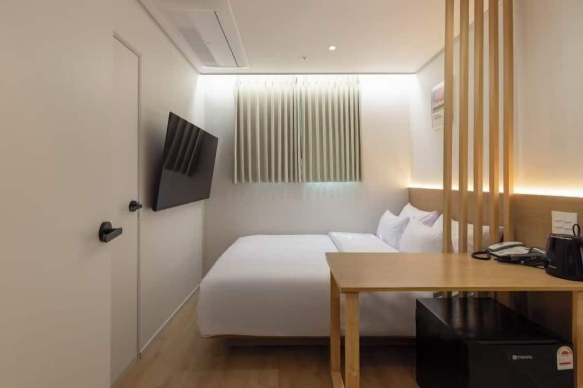 Premium bedding, blackout curtains, soundproofing, free WiFi