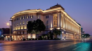 A large, classical building with a curved facade, multiple windows, and a prominent entrance. - The ERAVATI Sule Grand Yangon (Yangon)