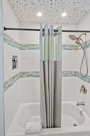 Shower, hair dryer, towels, shampoo