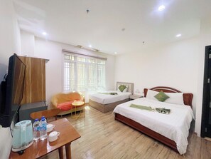 Basic Triple Room | Living area | 45-inch flat-screen TV with cable channels - Maris Da Nang Hotel & Apartment (Da Nang)