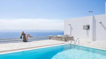 Outdoor pool, open 9:00 AM to 7:00 PM, pool umbrellas