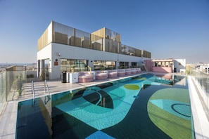 Outdoor pool, pool umbrellas, sun loungers
