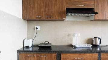 Fridge, microwave, electric kettle, cookware/dishes/utensils