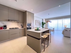 Coffee/tea maker, fridge, microwave, oven