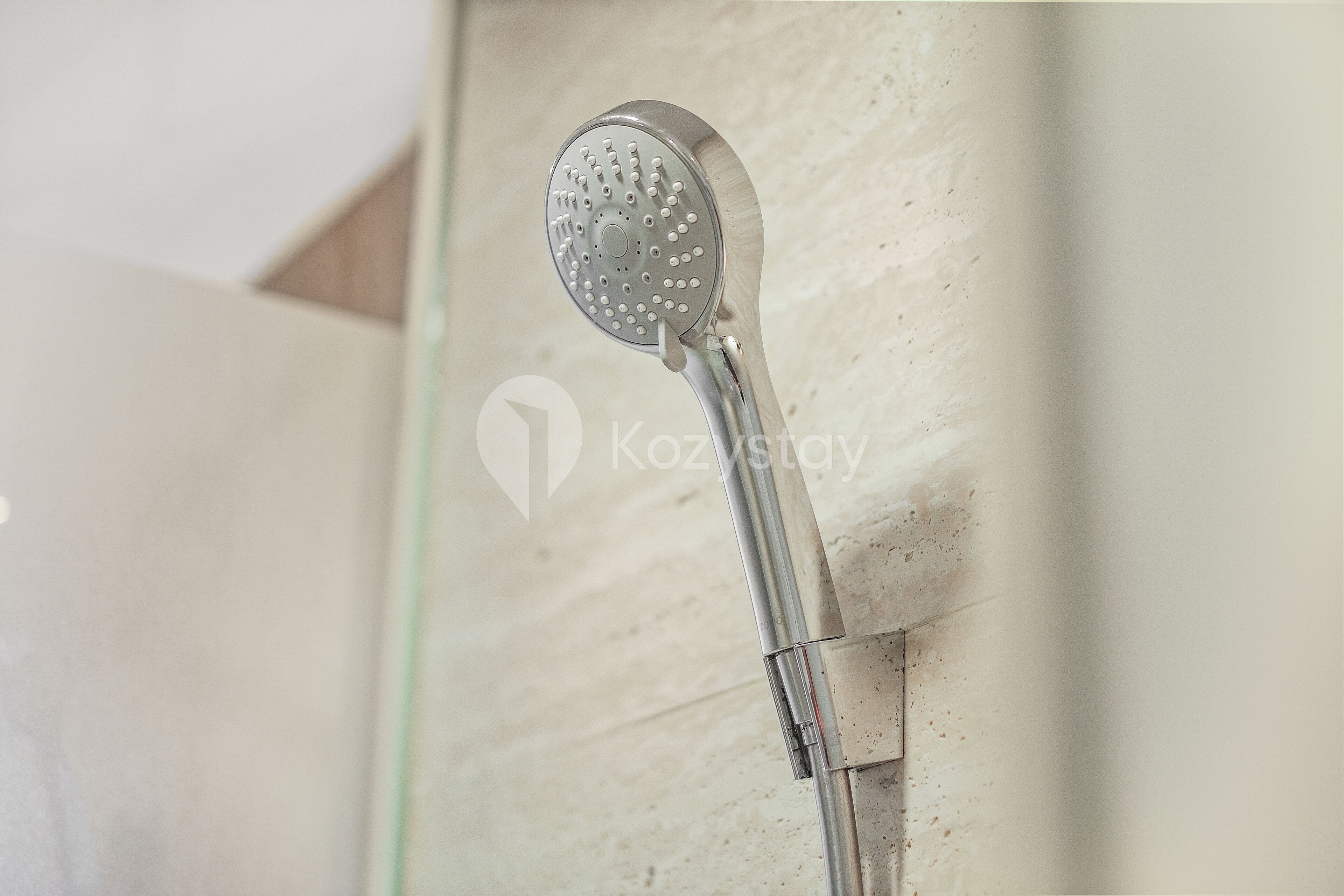 A showerhead mounted on a wall.