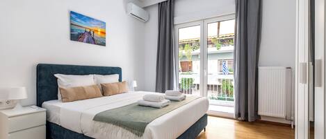 Apartment, 3 Bedrooms, Kitchen, City View | Desk, laptop workspace, blackout drapes, iron/ironing board