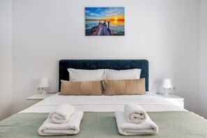 Apartment, 3 Bedrooms, Kitchen, City View | Desk, laptop workspace, blackout drapes, iron/ironing board