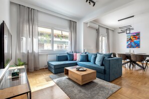 Apartment, 3 Bedrooms, Kitchen, City View | Living room | 55-inch Smart TV with digital channels, streaming services