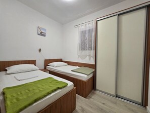 2 quartos, Wi-Fi de cortesia, roupa de cama