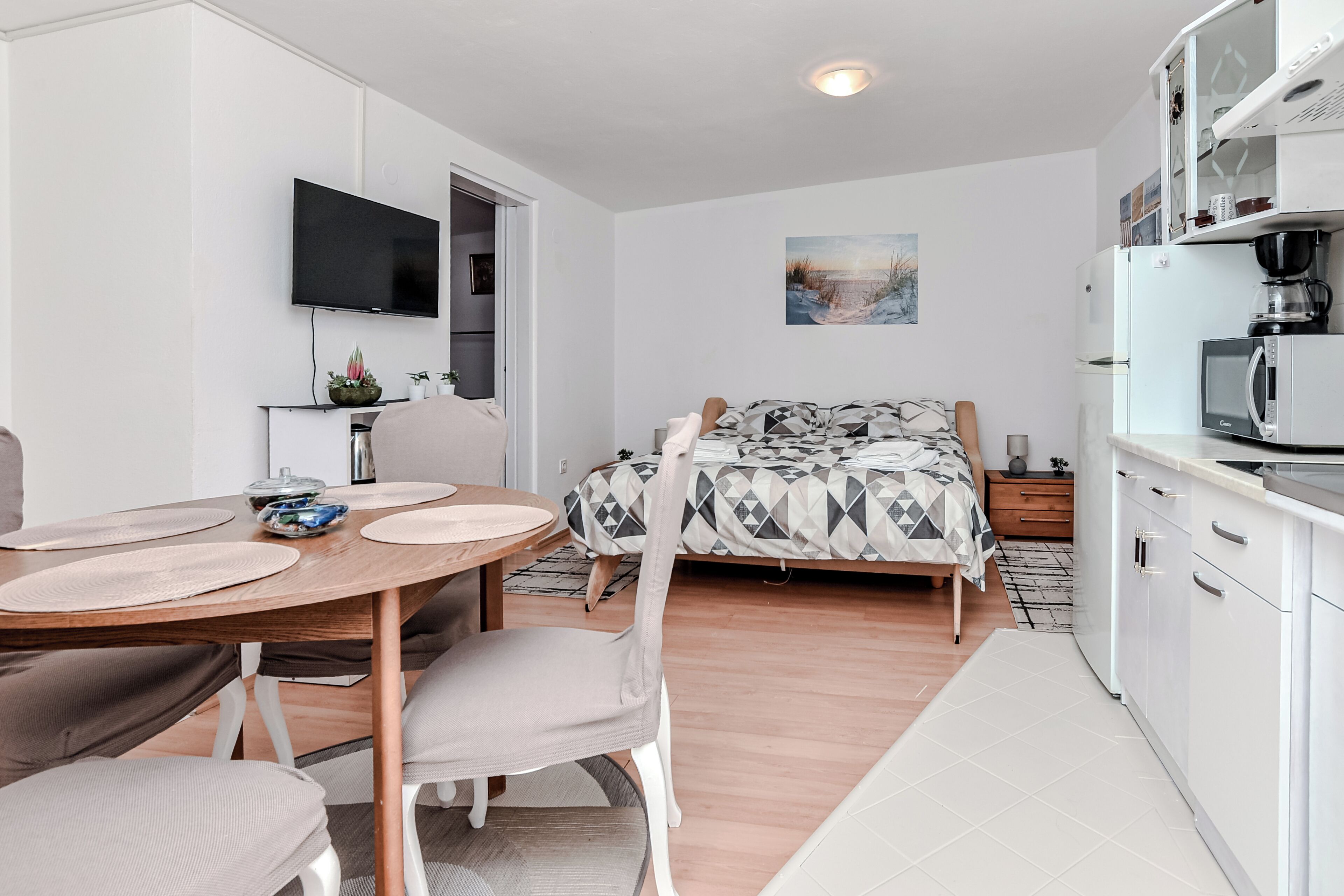 Basic Apartment, Garden View | Living area | 100-cm LCD TV with digital channels