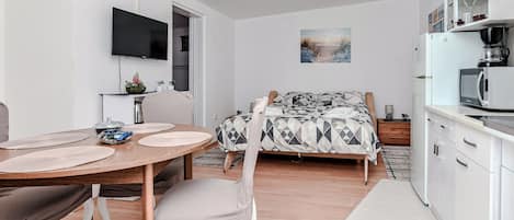 Basic Apartment, Garden View | Living area | 100-cm LCD TV with digital channels