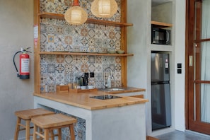 Villa, 1 Bedroom, Pool View | Private kitchen | Fridge, microwave, stovetop, cookware/dishes/utensils