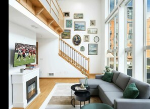 TV, fireplace, offices - Historic DT Loft w/16ft Ceilings |Garage &97 WS! (Seattle)