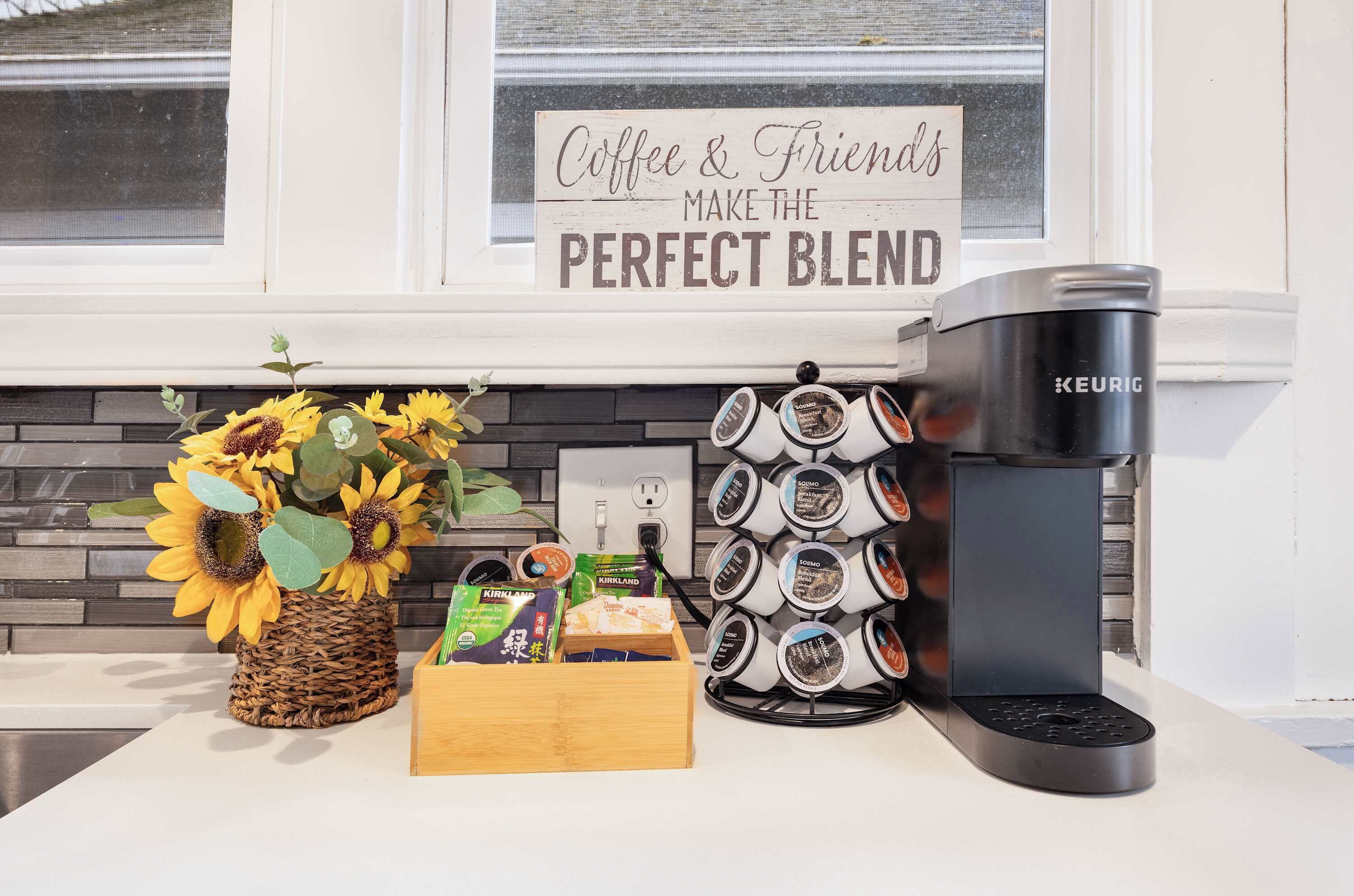 A sleek kitchen with gourmet gear and a coffee corner that’s pure joy.
