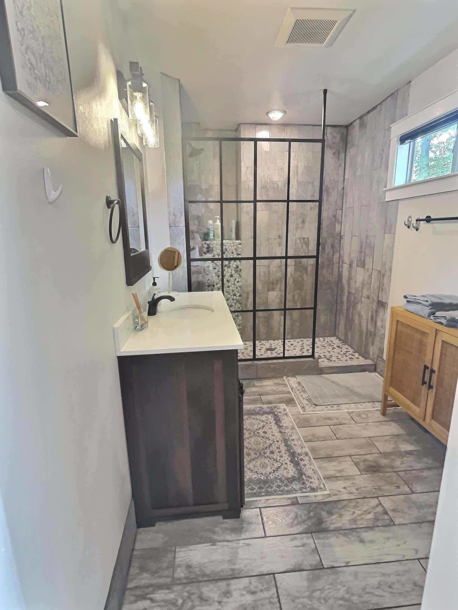Shower, hair dryer, towels, shampoo