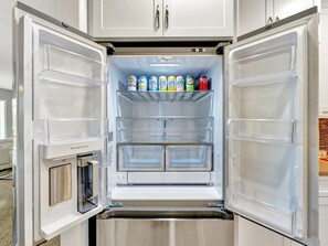 Your fridge is stocked with refreshing drinks and plenty of space for your favorites. Enjoy convenient storage in this bright, modern kitchen designed for your comfort. - Waterfront heated pool, dock, kayaks and bikes (St. Pete Beach)