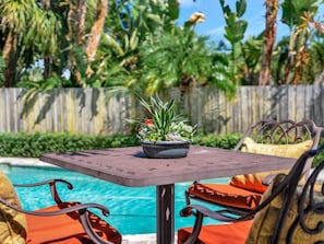 Picture yourself dining poolside under swaying palms and brilliant blue skies. Your private table awaits, with tropical breezes and sunshine framing every moment. - Waterfront heated pool, dock, kayaks and bikes (St. Pete Beach)