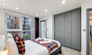 1 bedroom, desk, iron/ironing board, travel crib