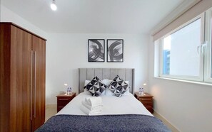 1 bedroom, desk, iron/ironing board, travel crib