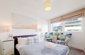 1 bedroom, desk, iron/ironing board, travel crib