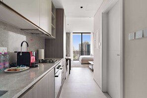 Fridge, microwave, oven, stovetop - Bright studio in Arjan with pool gym and parking (Dubai)