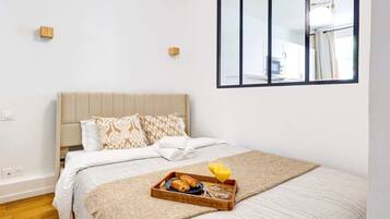 1 bedroom, desk, iron/ironing board, travel crib