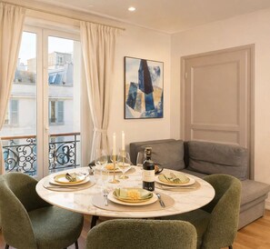 Standard Apartment, Courtyard View | Living area | 80-cm Smart TV with digital channels - TOCQUEVILLE (Paris)
